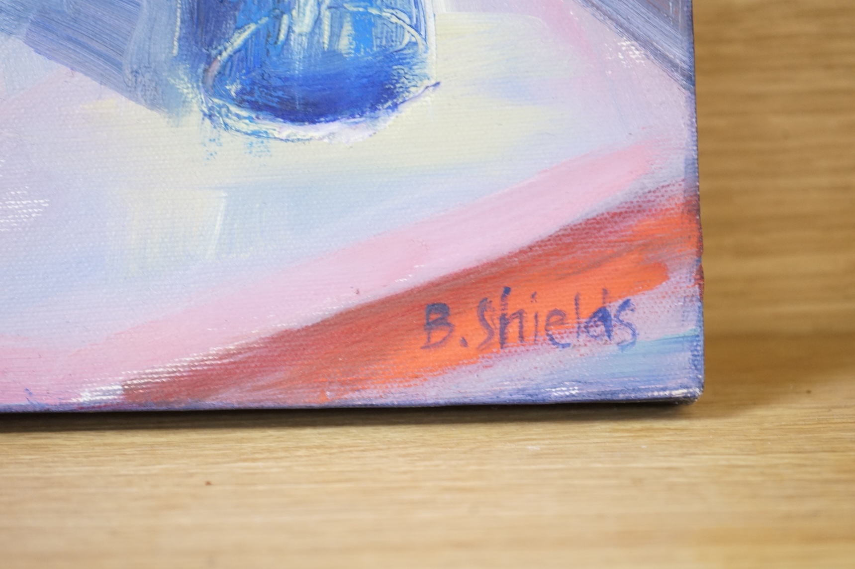 B. Shields, Still life of cornflowers, signed, oil on canvas, together with another, titled 'White flower in blue pot, tempura on canvas board, largest 30 x 24cm, one unframed